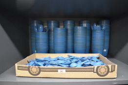 A large quantity of military mess cups and spoons.