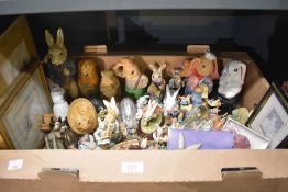 A large selection of rabbit studies including a Russian doll, glass paperweight and pictures.