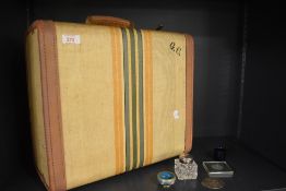 A vintage circa 1940's travelling case having fabric outer, leather binding and handle with G.C.