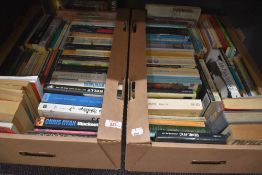 Two cartons of assorted novels including John Pilger-A Secret Country, seven vintage Doctor Who