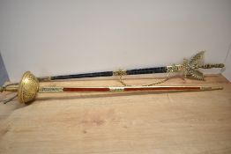 Two Spanish decorative souvenir reproduction swords, one being Toledo cup-hilt rapier style, the