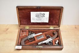 A pair of 19th century J Bunney & Son London Duelling Flintlock Pistols having turn off barrels,