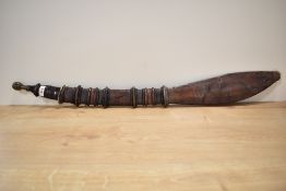 African possibly Nigerian origin tribal sword and decorative leather sheath, the curved blade made