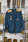 Russia/Soviet dress uniform with medals, badges and buttons, another uniform and overcoat, several
