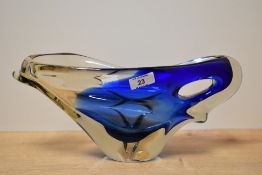 A mid-century Bohemia blue glass bowl, paper label to base, w35cm