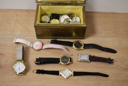 A metal jewellery box depicting boats, containing an assortment of wristwatches, including Lorus,