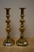 A pair of brass candlesticks, of traditional design, 30cm