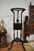 A 18th / 19th century mahogany wig stand on cabriole legs, having two central drawers with dove tail
