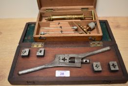 A 19th century Joseph Grey & Son medical brass syringe in fitted case with parts, L16cm, sold