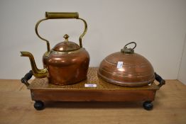 An early 20th century copper warming plate, L48cm, sold together with a copper hot water bottle