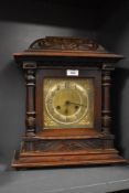 A 19th century mahogany 8-day bracket clock having brass chapter ring, a pair of doric columns