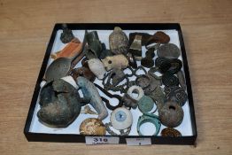 A box containing various ancient antiquities, to include a Greek Hallstatt bronze brooch, cooper