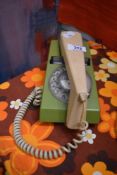 A retro Trimphone in two tone green with bakelite terminal box, L19cm