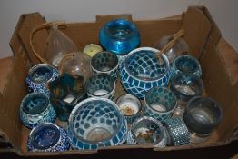 A mixed assortment of vintage tea light holders.