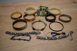 A small assortment of bracelets, including beaded examples, carved pieces etc
