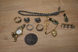 A small assortment of costume jewellery, including clip-on earrings, rings and a Regus wristwatch,