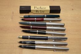 Seven fountain pens. Three Parker 45, a Parker Slimfold (boxed), two Parker 51 one in burgundy one