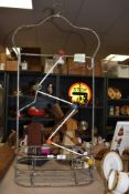 A vintage swimming pool hanger, h85cm , sold together with a retro atomic style coat hanger,