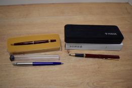 A boxed Parker Rialto roller ball pen, a Parker Jotter ballpoint and a Papermate lady ballpoint pen
