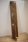A vintage hand carved mangle board having 'J.A.P.A.P.D' 1822 to the front, measuring 77cm in