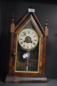 A 19th century 8-day mahogany architectural mantel clock, the case interior bottom patented by