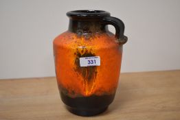 A mid-century West German Lava vase of baluster form decorated in tango and brown colour glaze,