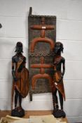 A pair of African hard wood figures, one having shield in hand, h76cm, sold together with an African