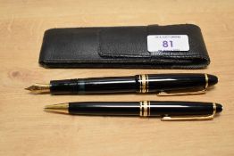 A Montblanc 146 piston fill fountain pen and ballpoint pen set in black with a 4810 14k 585 nib. The
