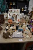 'The Ultimate Doll Book' by Caroline Goodfellow sold alongside an assortment of porcelain dolls