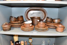 An attractive Finish 'Arabia' pattern part ceramic dinner service, decorated in brown stone glaze,