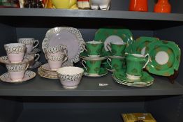 A Sutherland H & M Bone China part tea service, decorated in pink with gilt motifs, (18), sold