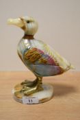 A onyx seagull study having brass feet standing on a circular onyx base, h18.5cm.