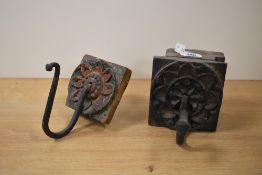 A pair of 19th century wooden wall hanging hooks, the blocks hand carved with geometric patterns,