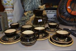 An attractive Coldstone pottery combed slip glaze coffee set, impressed marks to base, 18 pieces
