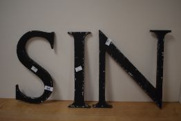 Three large vintage letters N,I and S.