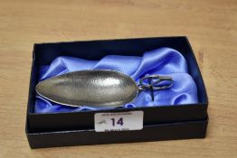 A reproduction duck handled child's feeding spoon, having hammered textured pattern and in the