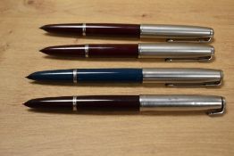 Four Parker 51 aerometric fill fountain pens with lustraloy caps. One with damaged cap