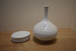 A 20th century Meissen onion shaped vase, having textured dot pattern on a white glaze ground,