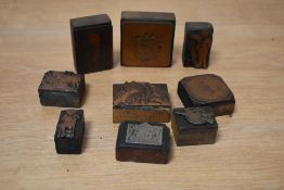 A group of vintage printing blocks, subject matters include Spanish waiter, country landscape