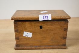 A small 19th century oak box having exposed dove tail joints and plinth base, L17cm x H11cm