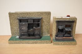 Two vintage dolls house kitchens, the largest measuring 24cm x 17cm.