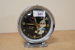 A retro novelty Chinese Hero animated alarm clock depicting a rabbit figure with carrot, h12cm