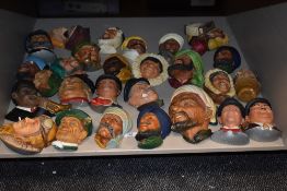 A large group of cast chalk bosson heads, to include R.F.C Pilot, 1917, Oliver Hardy, Trumpet