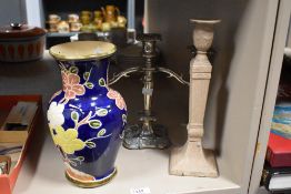 A heavy Victorian Neo Classical style cast iron candlestick, having classical motifs, H30cm, sold