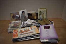 A box containing various post cards and stamp albums, to in include Dorset, Salmon, College of