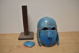 An early 20th century ceramic reproduction Angelo Saxon helmet having suspended parts in a blue