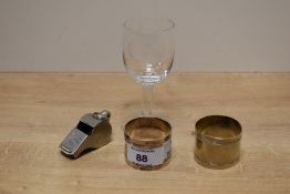 An ACME Thunderer whistle, two Spanish 'Potosi Silver' white metal napkin rings and an interesting