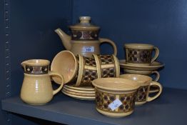 An attractive 1970's J&G Meakin coffee set for six, mottled beige with repeating stylised floral