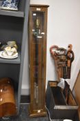 An early 20th century Fortin-type Barometer by Casella of London, suspended in an oak glazed case,