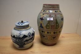 A Moroccan Safi pottery vase, decorated bands of repeating designs, 29cm sold together with a